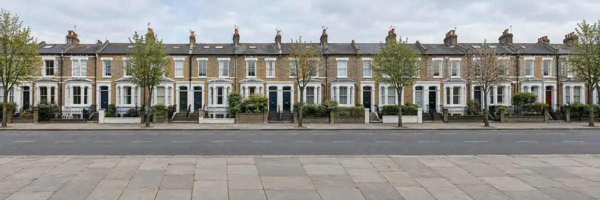 Illustrative London terraced houses across a quiet street